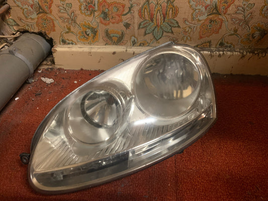 Phare avant gauche pour VOLKSWAGEN GOLF V Fond gris